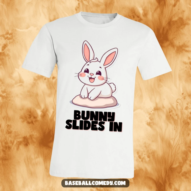 Funny T-shirt showing a happy cartoon bunny sliding headfirst into home plate with a wide, triumphant grin, celebrating a score.