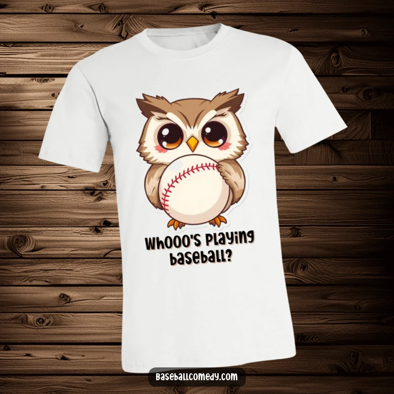 Funny t-shirt featuring a curious owl with comically wide eyes gazing at a baseball, a truly humorous graphic.