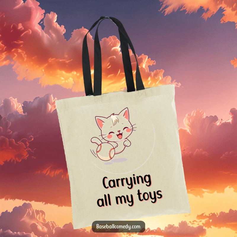 Funny cat tote bag illustrating a playful kitten comically chasing a baseball, ideal for stylish, humorous carrying.